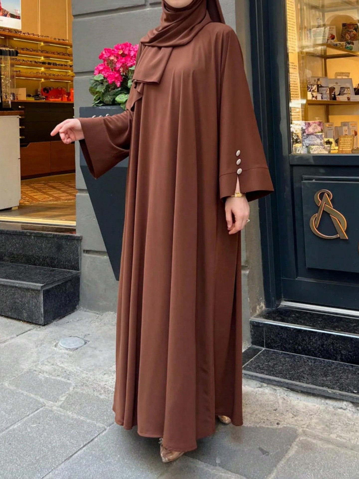 Button Abaya Color: Brown | Size: S, M, L, XL | Design Detail: Button, Cape | Season: All Seasons | Quantity: 1 Piece | Sleeve Length: Long Sleeve | Fit Type: Oversized | Stretchability: Not Stretchable