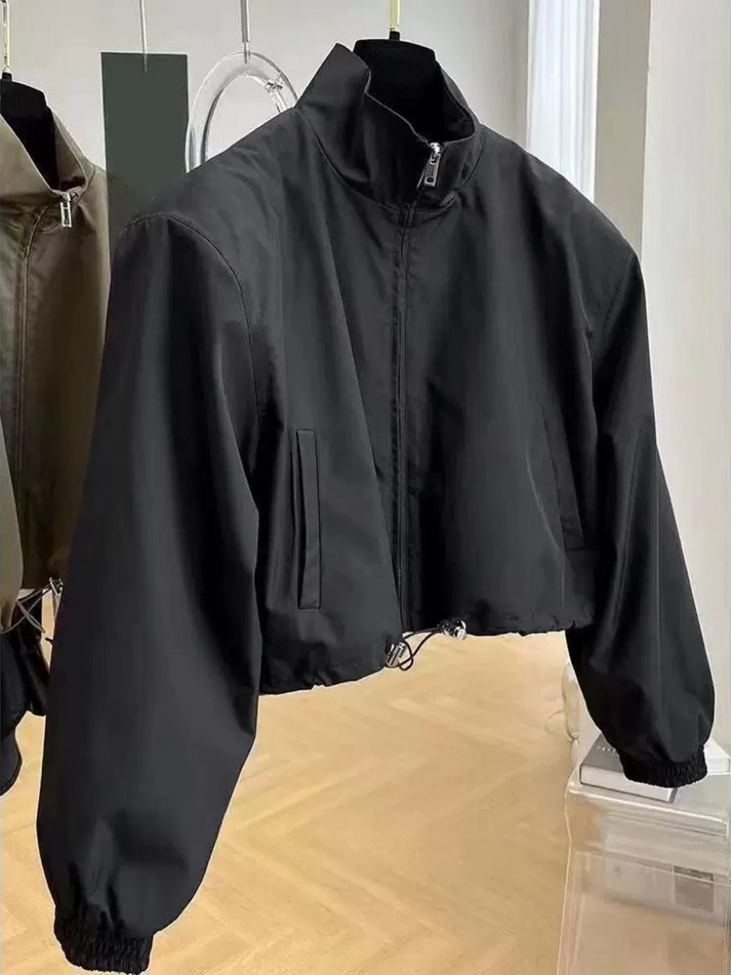 Drawstring Windbreaker Jacket Color: Black | Size: One-Size | Design Detail: Drawstring | Main Fabric: Flat Woven | Stretchability: Not Stretchable | Fit Type: Oversized | Quantity: 1 Piece | Belt: Does not come with Belt | Sleeve Length: Long Sleeve